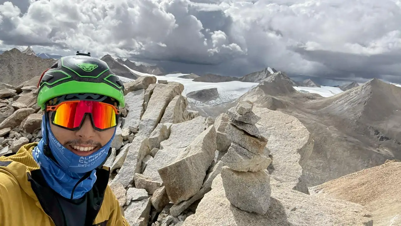 Alpine Climber at Summit of Chhuama IV